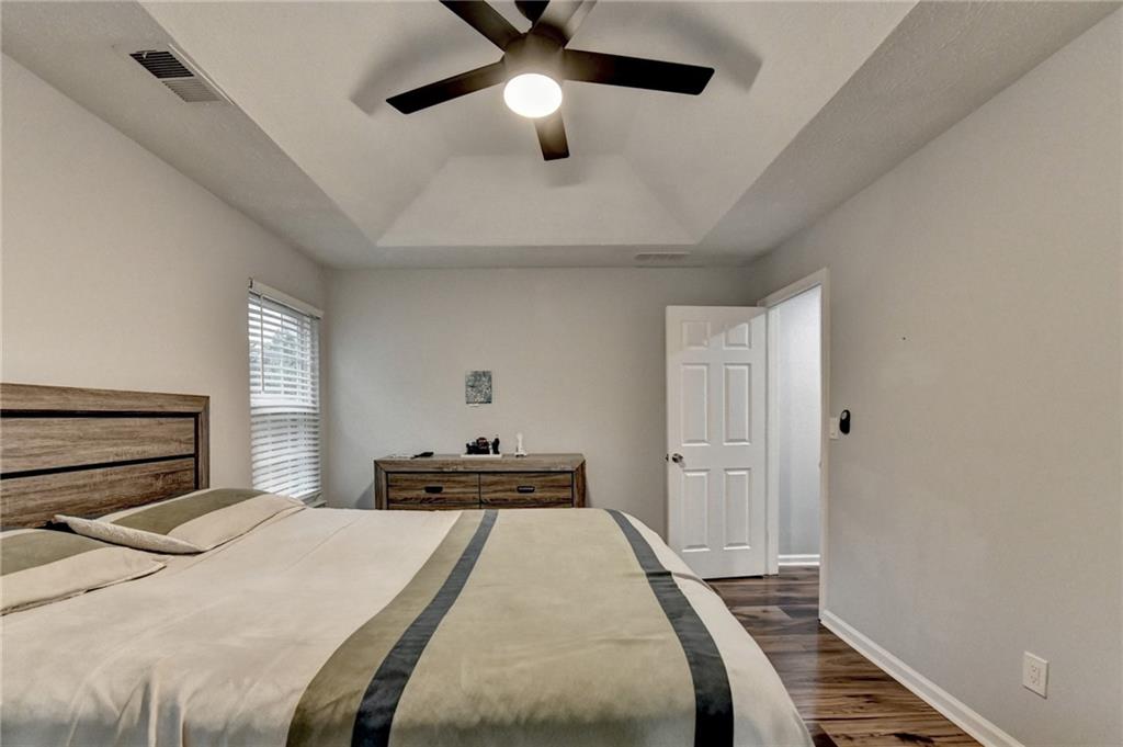 2066 Pinnacle Pointe Drive Norcross, GA 30071 - Photo 34 of 56 a bedroom with a bed and a chandelier