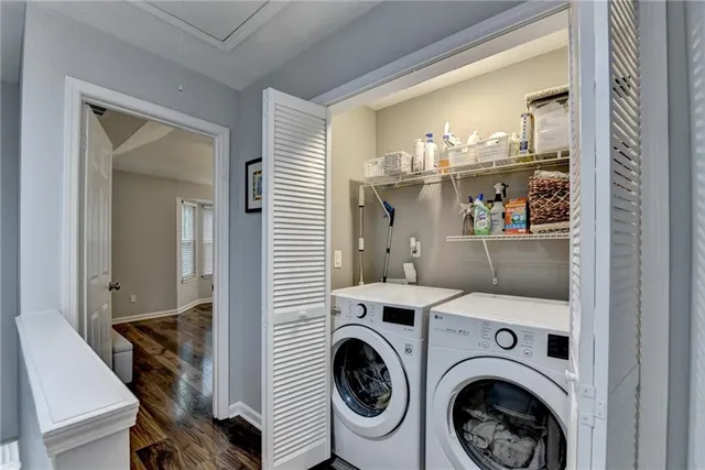 a bedroom with a bed and a flat tv screen on dresser