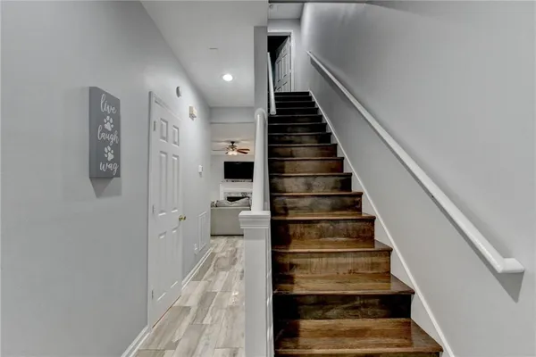 a view of entryway and gallery with wooden floor