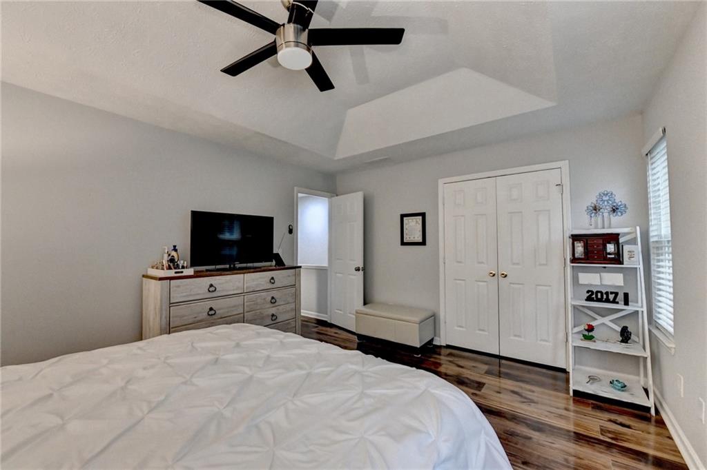 2066 Pinnacle Pointe Drive Norcross, GA 30071 - Photo 42 of 56 a bedroom with a bed and a flat screen tv