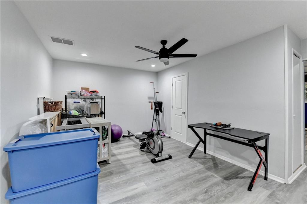 2066 Pinnacle Pointe Drive Norcross, GA 30071 - Photo 47 of 56 a view of a workspace with furniture and gym equipment