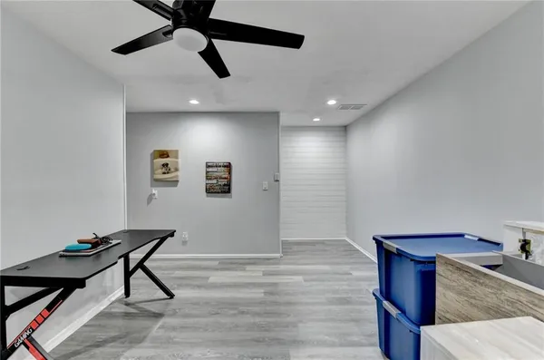 a view of a wooden chairs in patio of a house
