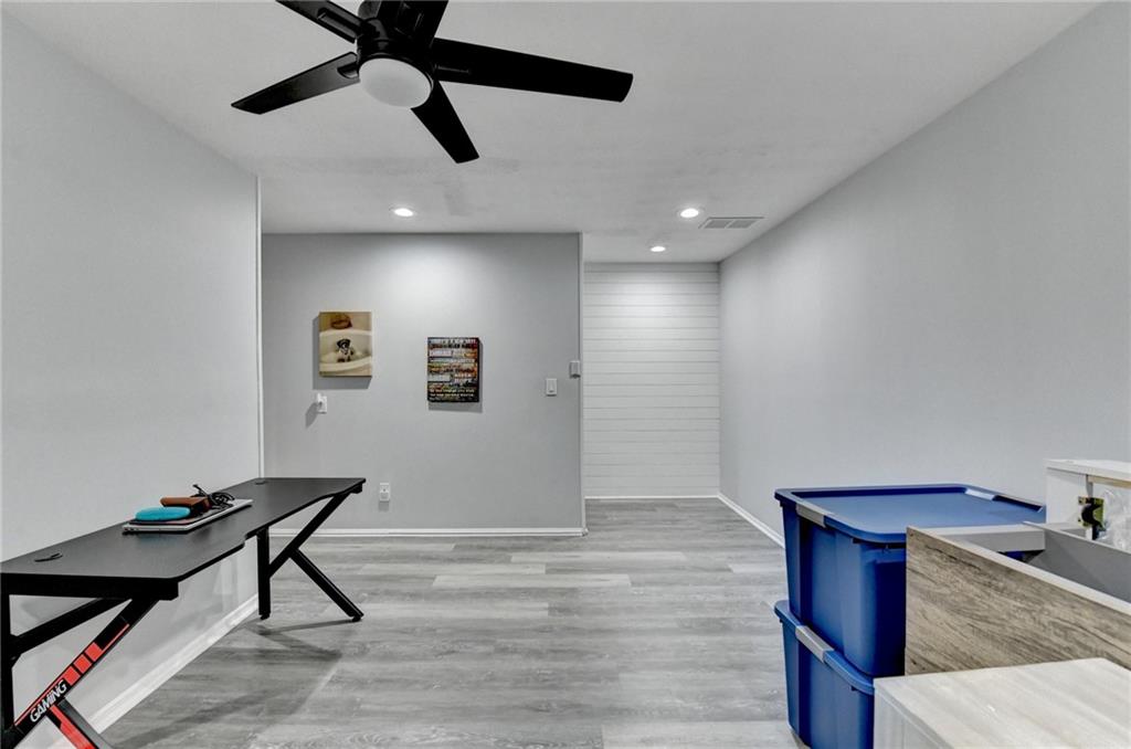2066 Pinnacle Pointe Drive Norcross, GA 30071 - Photo 49 of 56 a room with wooden floor and ceiling fan