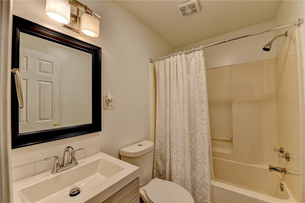 2066 Pinnacle Pointe Drive Norcross, GA 30071 - Photo 50 of 56 a bathroom with a sink toilet and shower