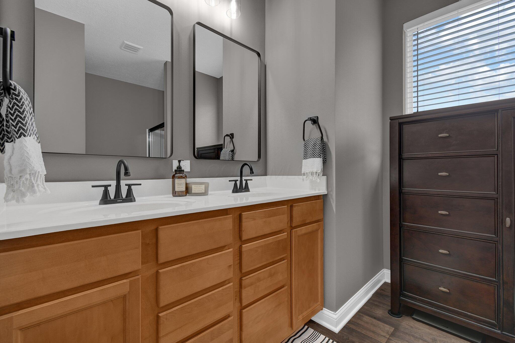916 Rooks Circle Sunbury, OH 43074 - Photo 17 of 39 Dual vanity with upgraded light fixtures, mirrors, and faucets and low-maintenance LVP flooring!