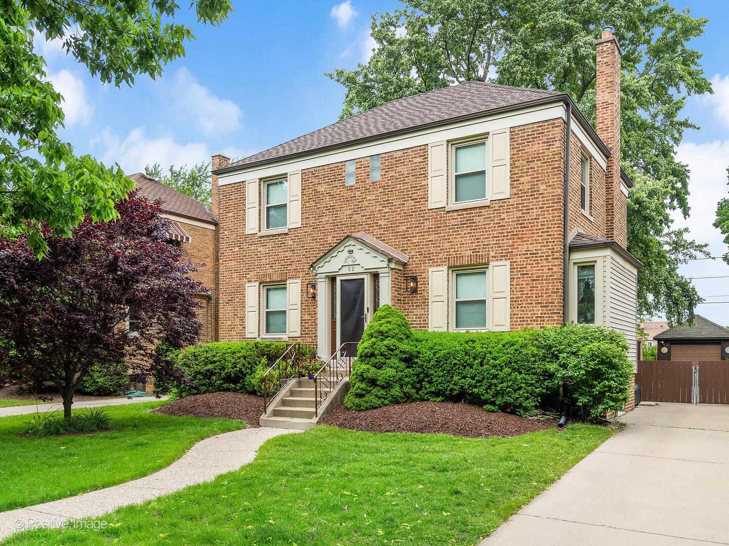 82 Northgate Road Riverside, IL 60546 - Photo 1 of 27 a front view of a house with a yard