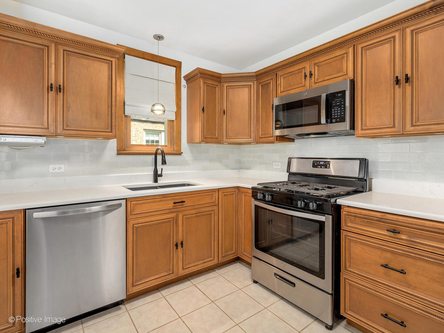82 Northgate Road Riverside, IL 60546 - Photo 8 of 27 a kitchen with stainless steel appliances granite countertop a sink stove and microwave