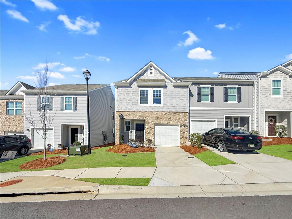 a front view of a house with a yard