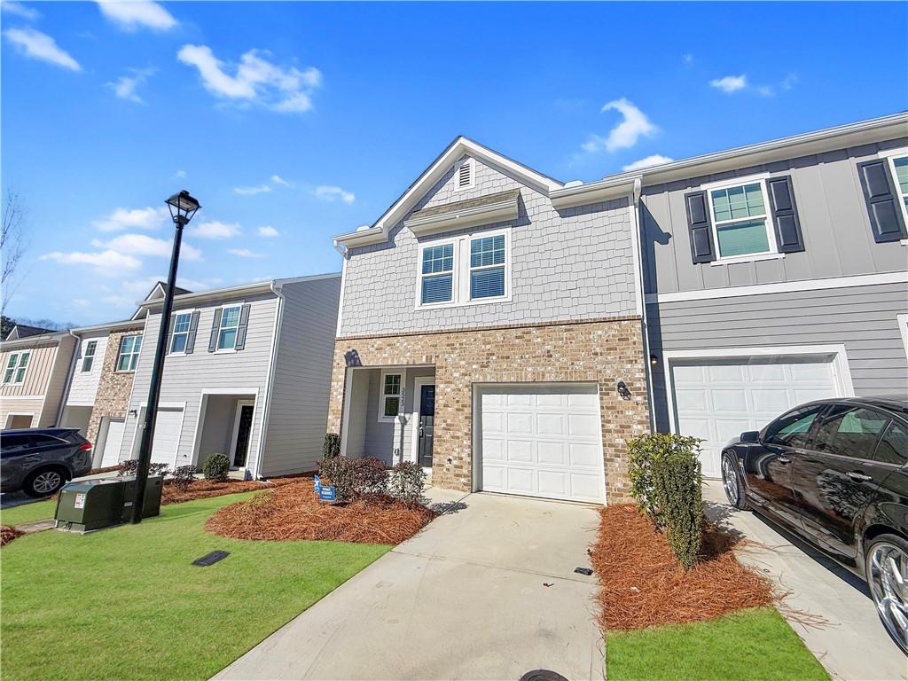 3523 Condor Court Atlanta, GA 30331 - Photo 19 of 23 a front view of a house with a yard and garage
