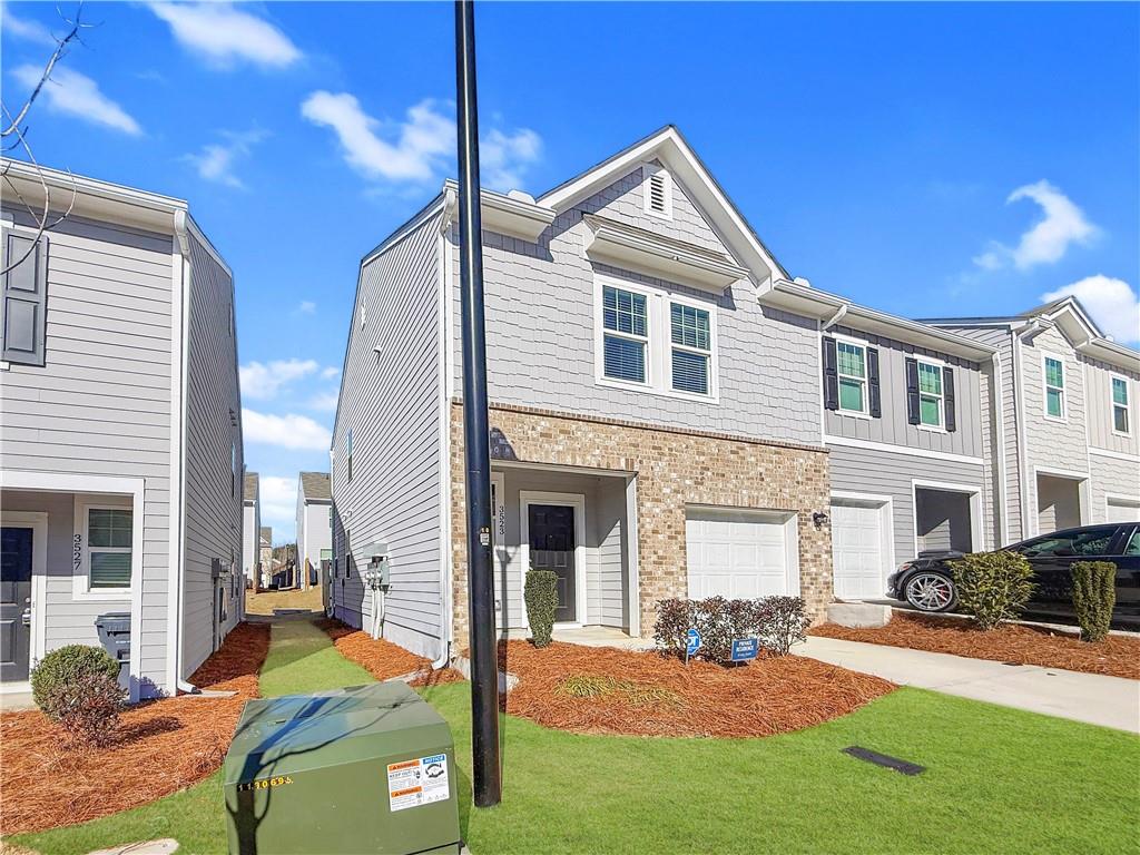 3523 Condor Court Atlanta, GA 30331 - Photo 2 of 23 a front view of a house with a yard