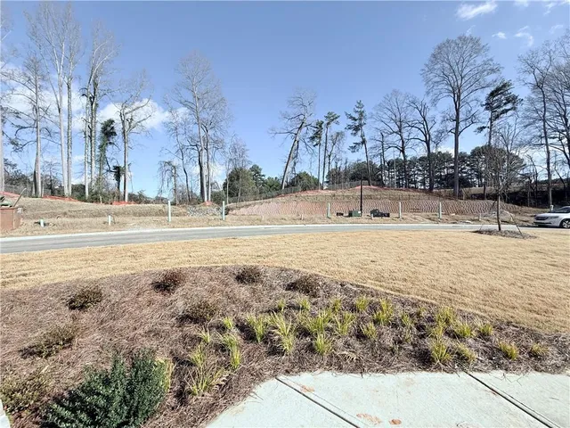 a view of a house with swimming pool and sitting area