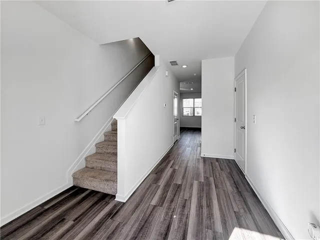 a view of entryway with wooden floor