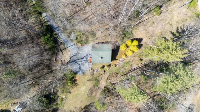 a aerial view of a house with a yard