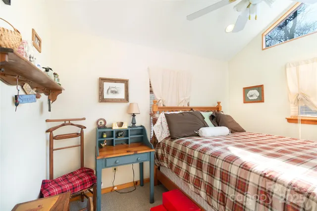 a bedroom with a bed and a couch