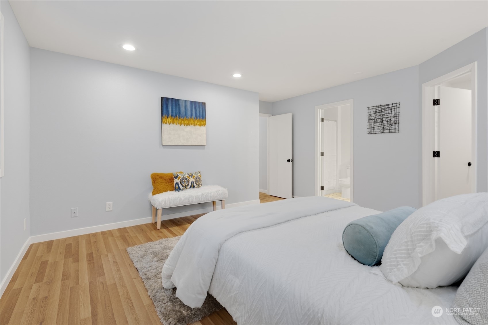 2409 180th Street Southeast Bothell, WA 98012 - Photo 16 of 40 a bedroom with a bed and a painting on the wall