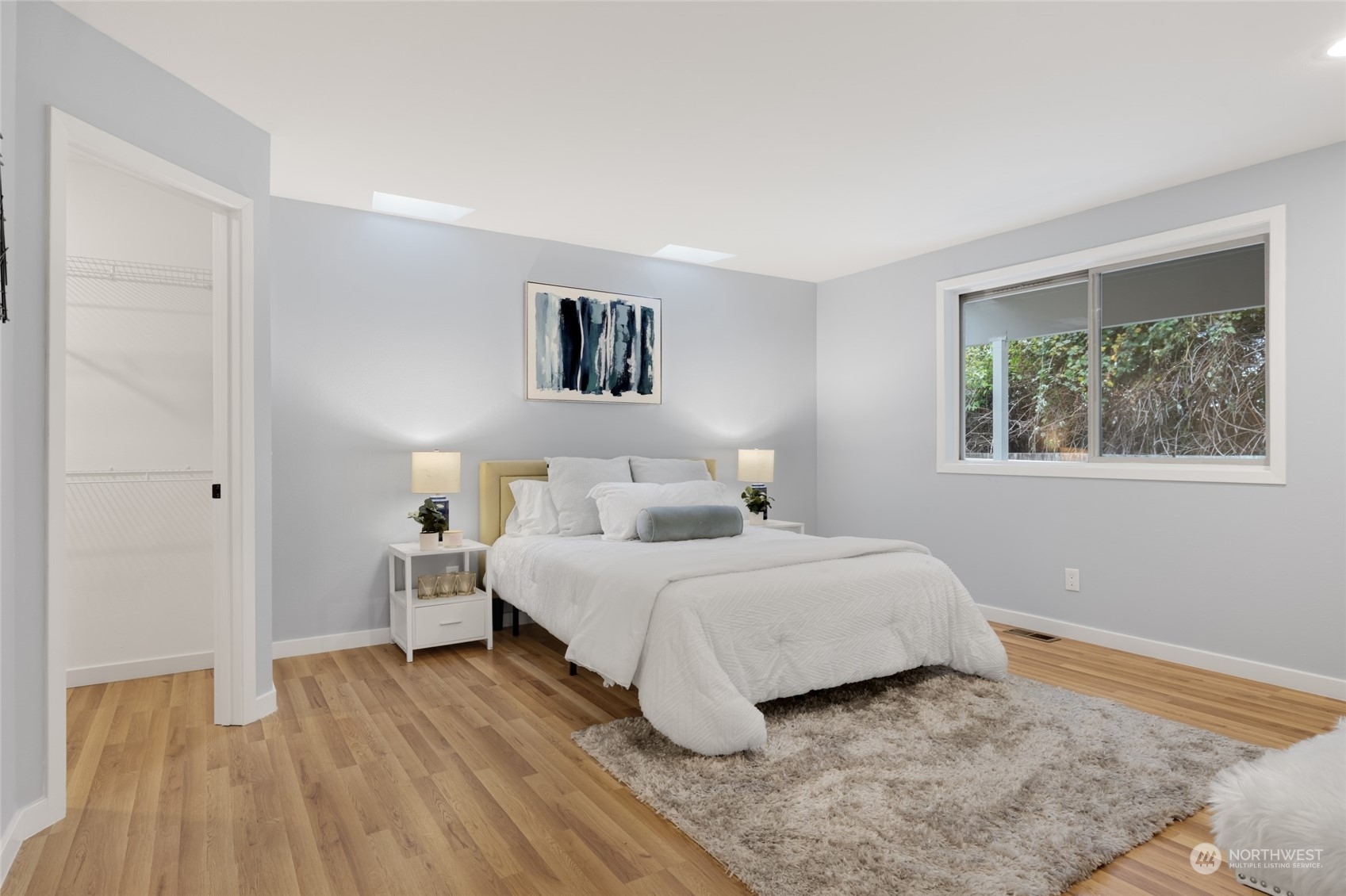 2409 180th Street Southeast Bothell, WA 98012 - Photo 17 of 40 a bedroom with a bed and a window