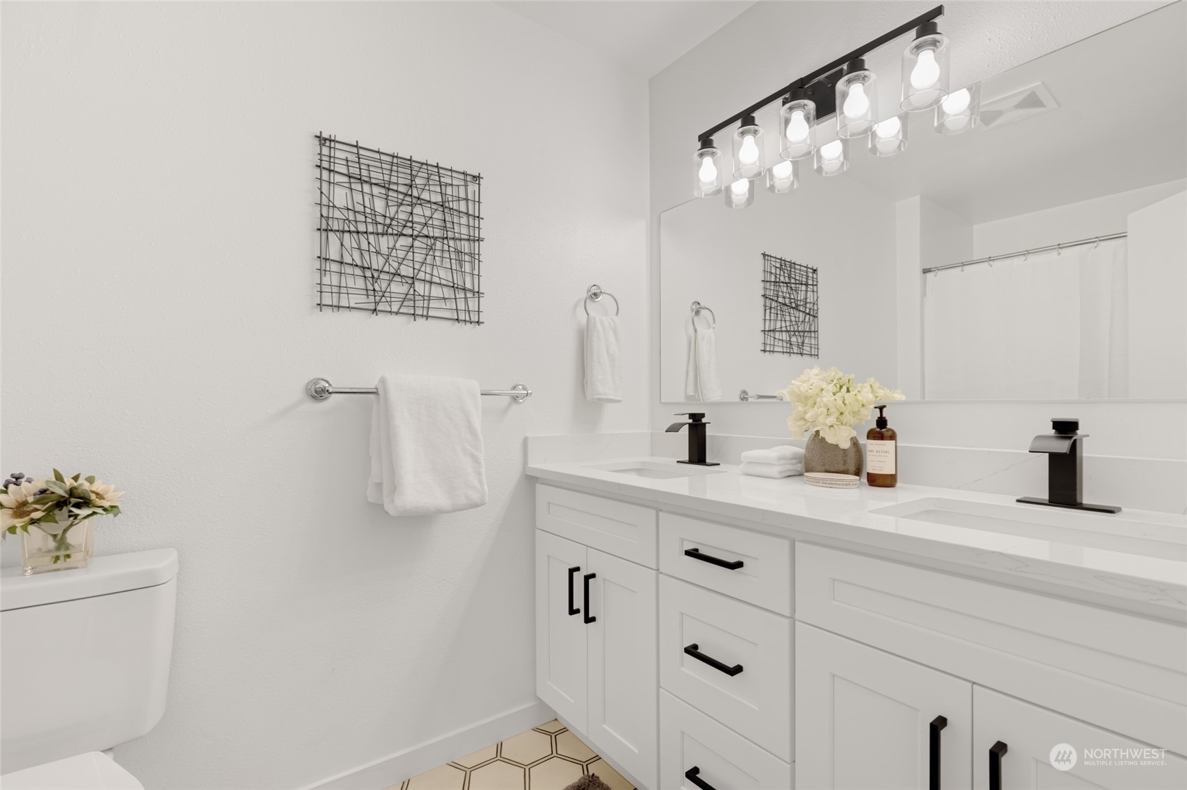 2409 180th Street Southeast Bothell, WA 98012 - Photo 19 of 40 a bathroom with a sink a vanity and a mirror