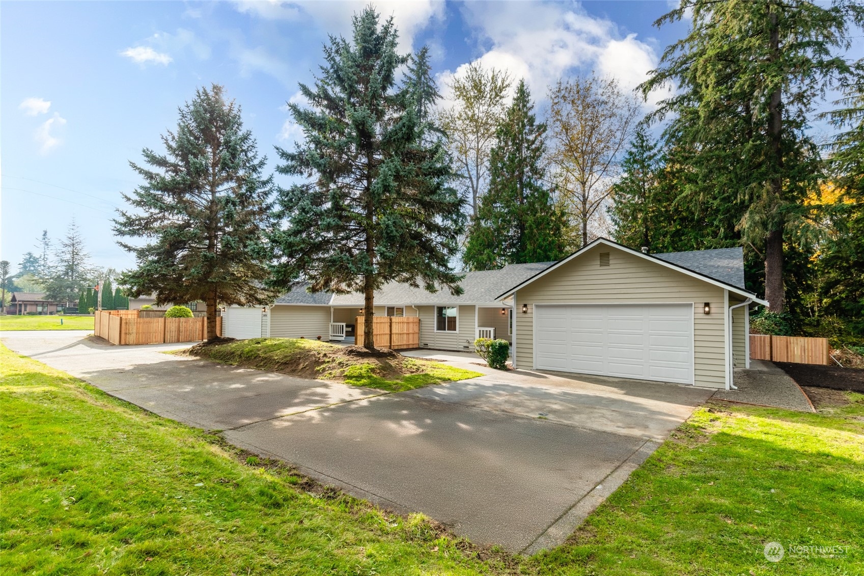 2409 180th Street Southeast Bothell, WA 98012 - Photo 2 of 40 a view of a house with pool and trees in the background