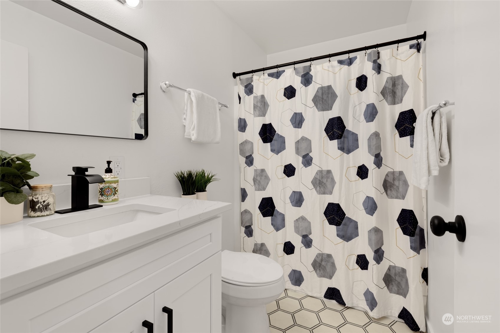 2409 180th Street Southeast Bothell, WA 98012 - Photo 24 of 40 a bathroom with a sink a toilet and a mirror