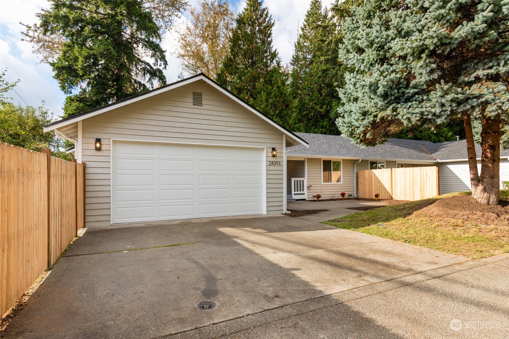 2409 180th Street Southeast Bothell, WA 98012 - Photo 28 of 40 a view of a house with a yard and large tree