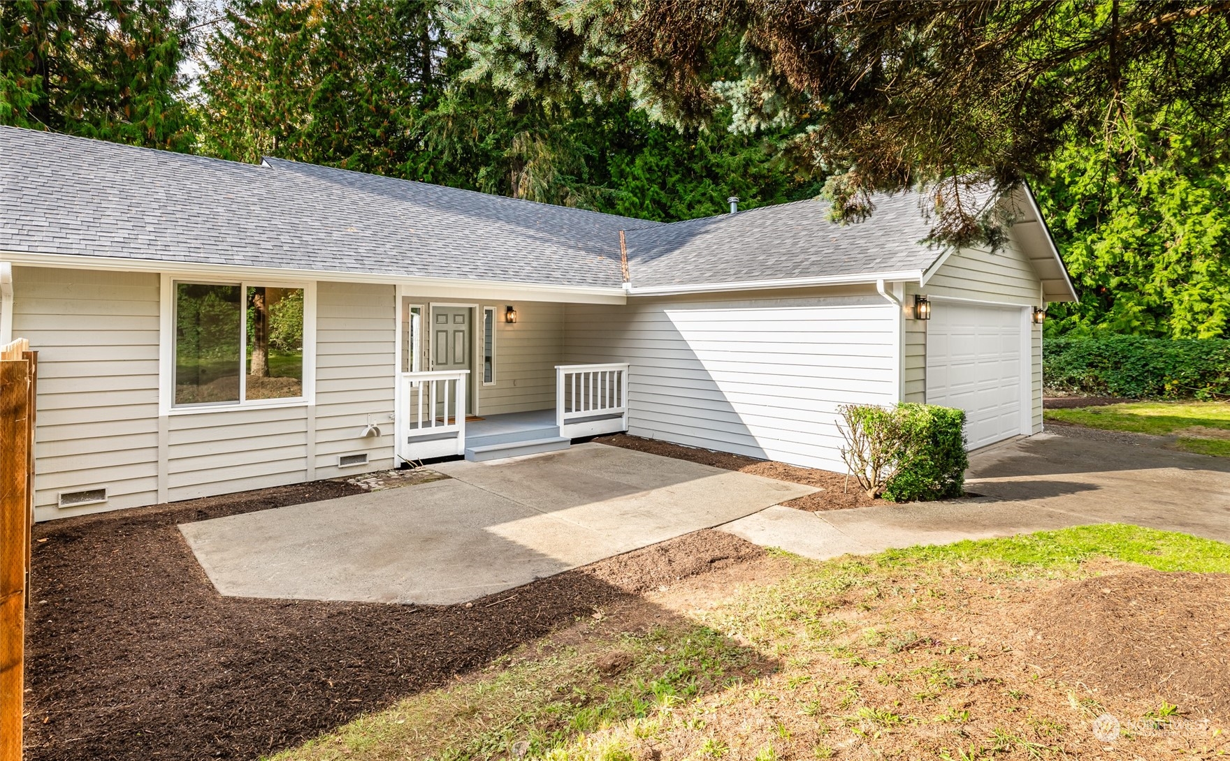 2409 180th Street Southeast Bothell, WA 98012 - Photo 29 of 40 a view of a house with a patio