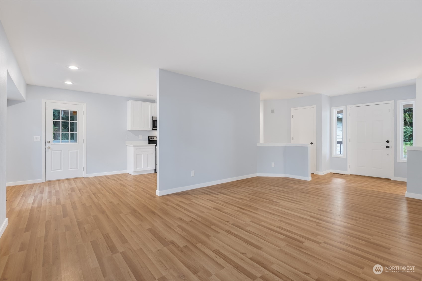 2409 180th Street Southeast Bothell, WA 98012 - Photo 31 of 40 a view of empty room with wooden floor and window