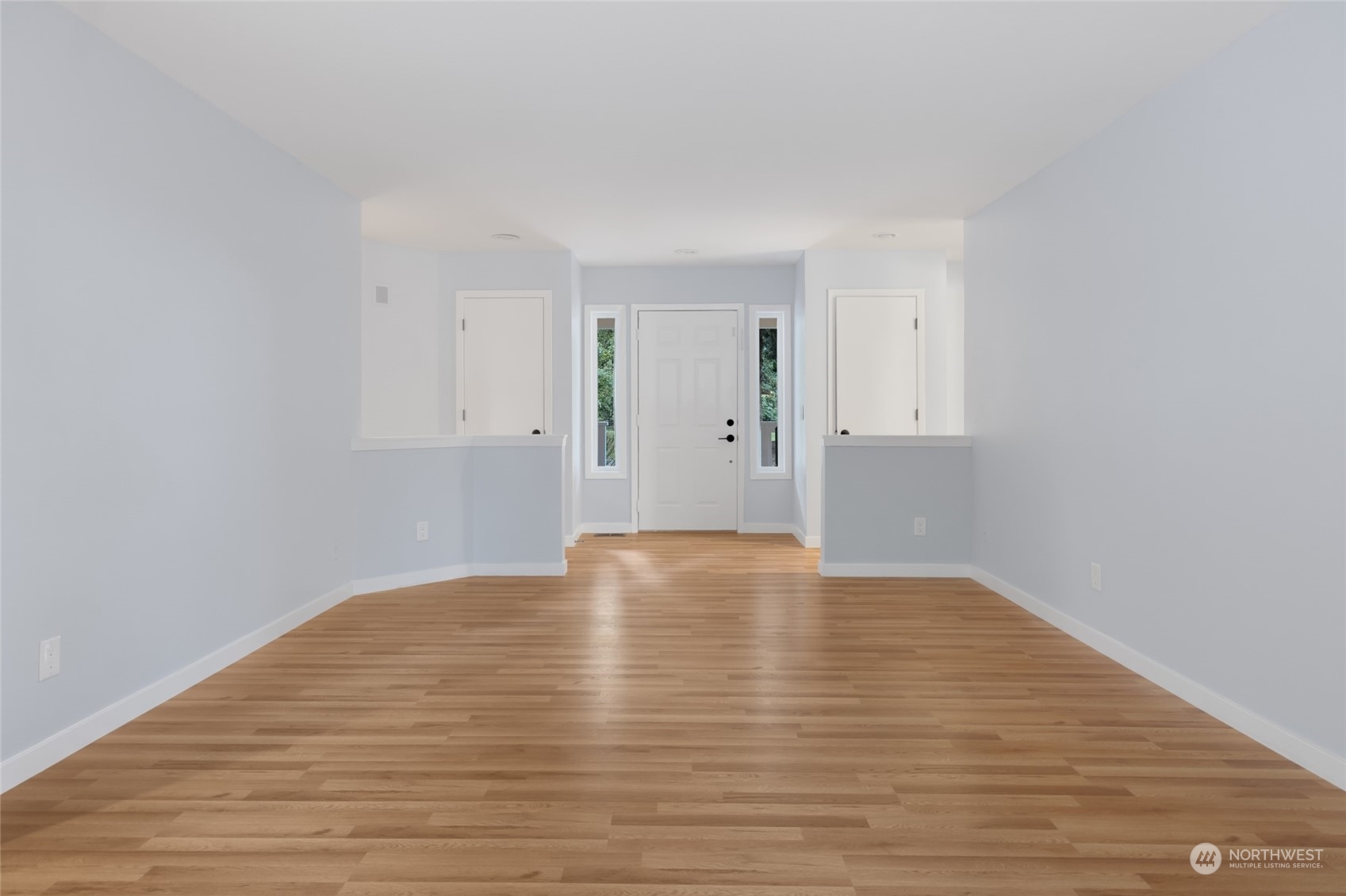 2409 180th Street Southeast Bothell, WA 98012 - Photo 33 of 40 a view of an empty room with wooden floor