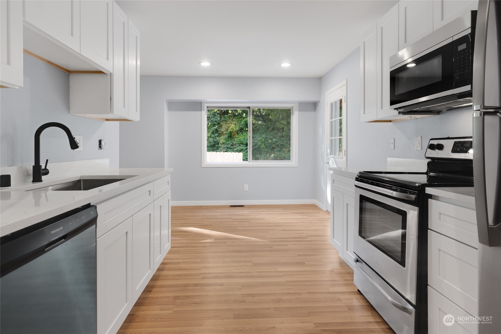 2409 180th Street Southeast Bothell, WA 98012 - Photo 35 of 40 a kitchen with a sink and steel appliances
