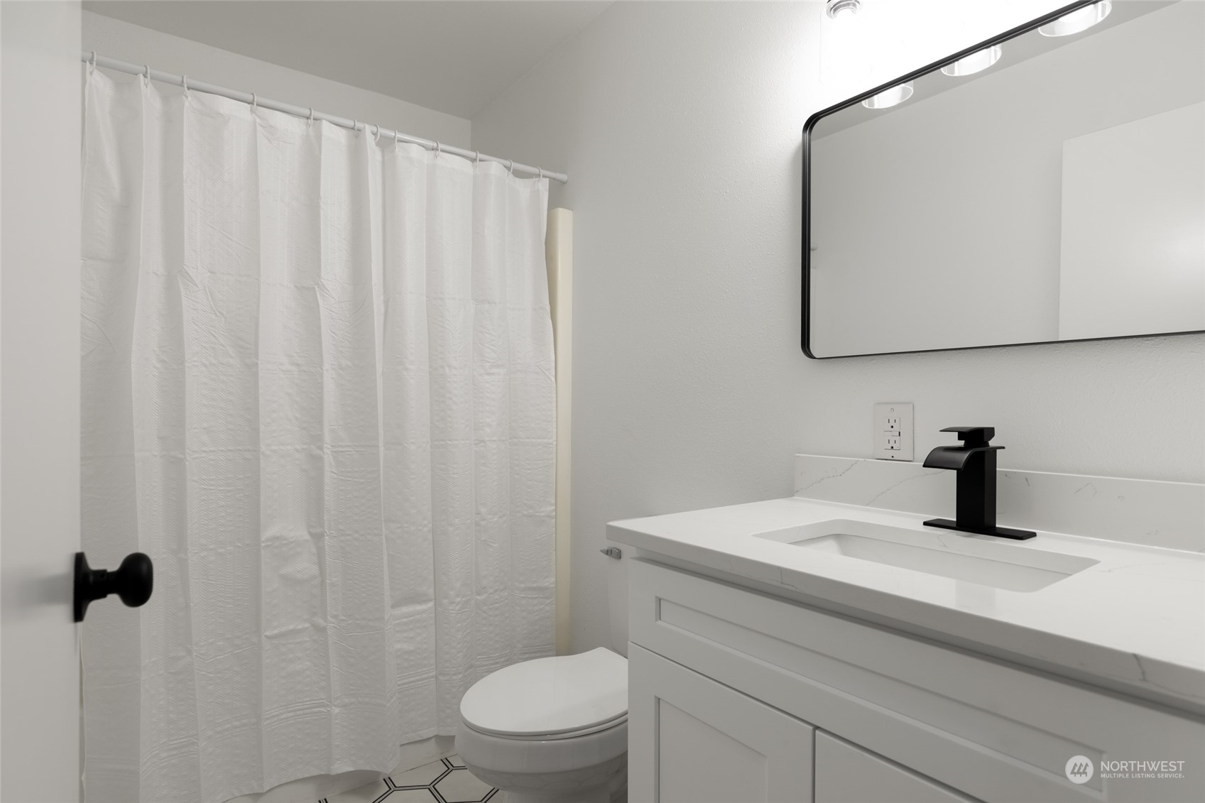 2409 180th Street Southeast Bothell, WA 98012 - Photo 38 of 40 a bathroom with a sink and a vanity