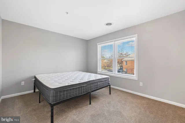 a room with a bed and a window