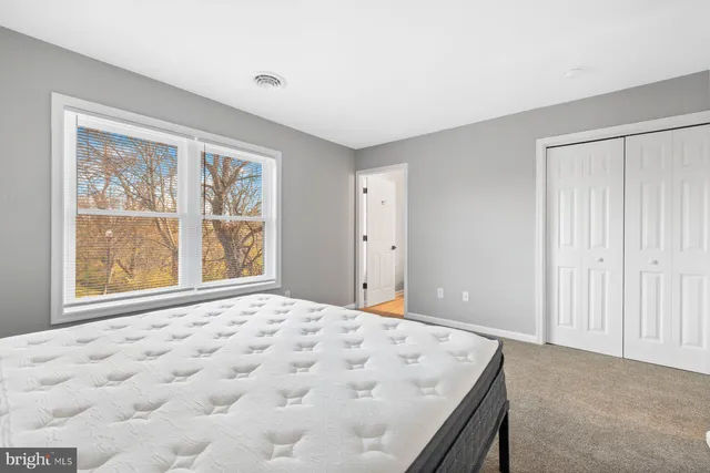 a view of a bedroom with window