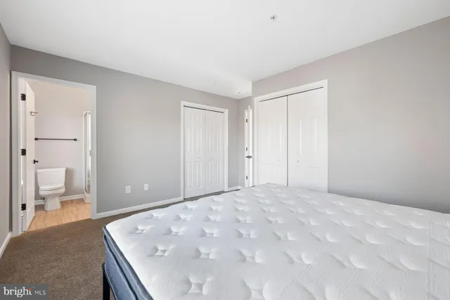 a bathroom with a shower and a toilet