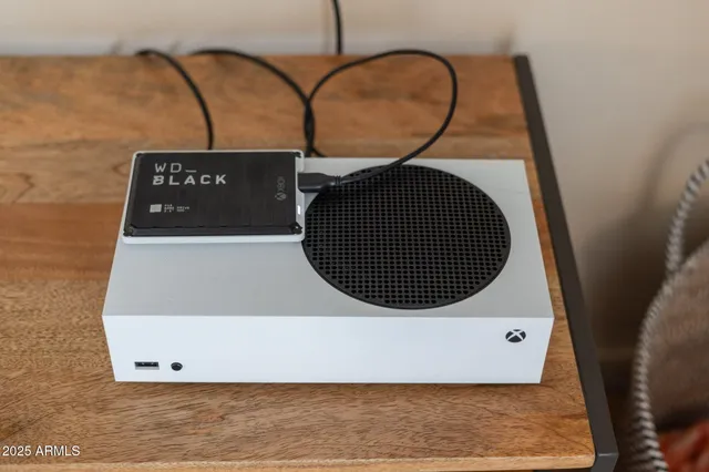 a view of a two chairs in the balcony