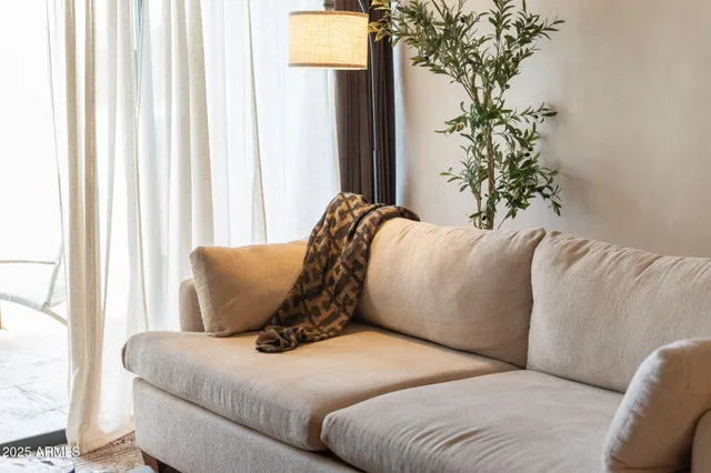 a bathroom with a toilet and a mirror