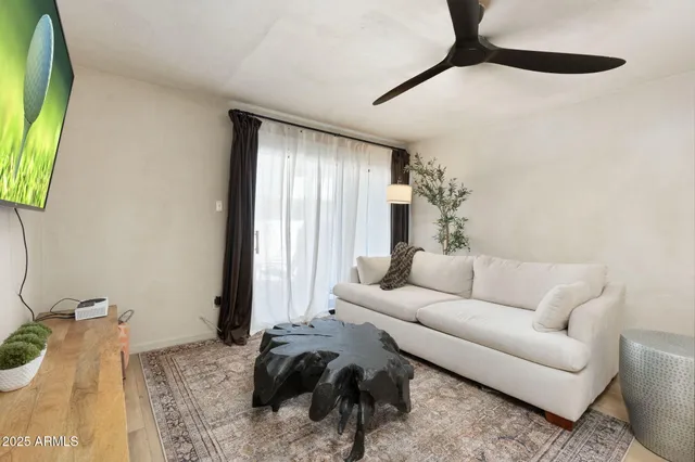 a living room with furniture and a window