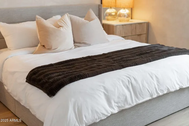 a view of a dining room with furniture wooden floor and a chandelier