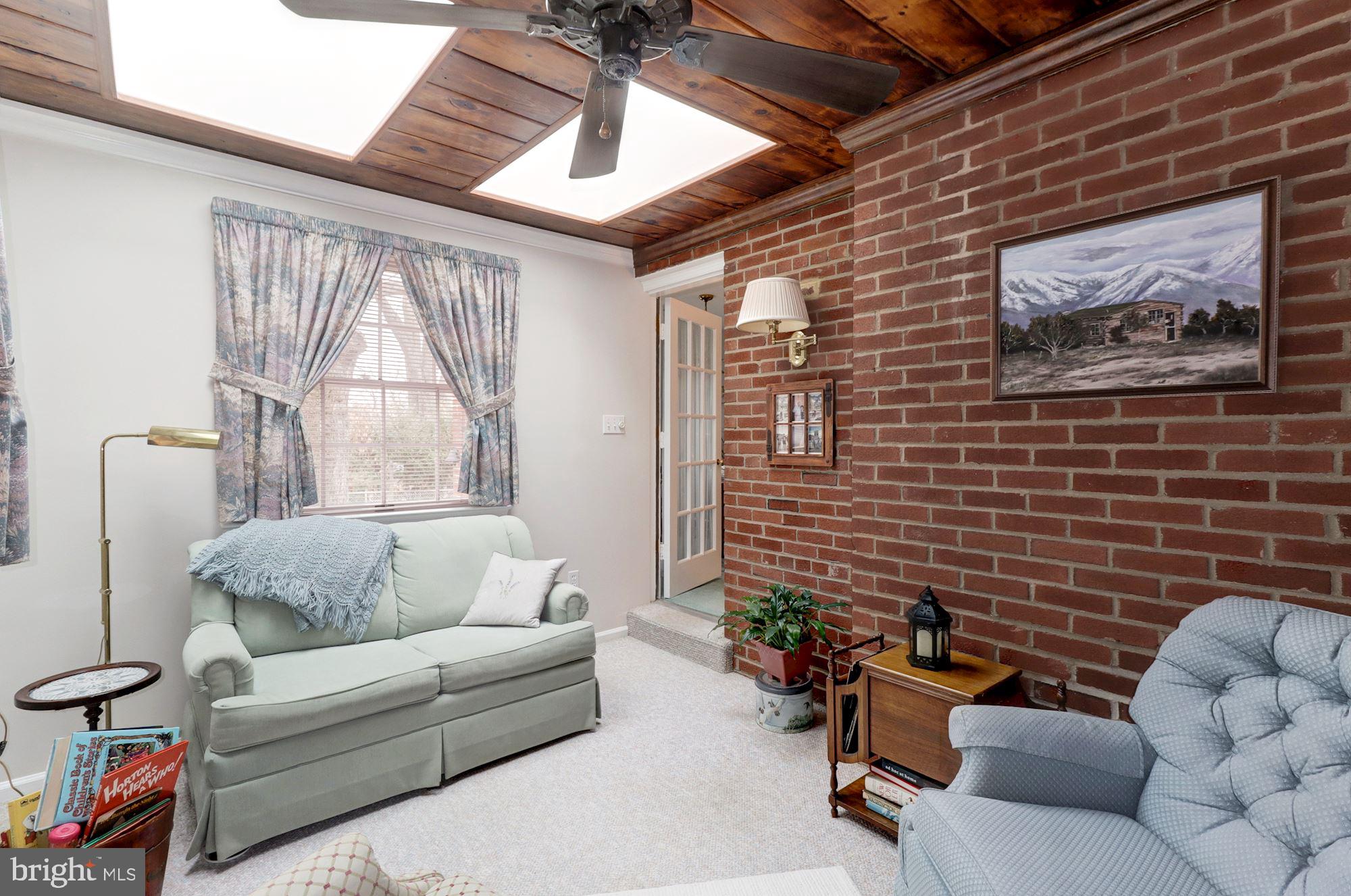6536 Little Falls Road Arlington, VA 22213 - Photo 10 of 27 Den with Brick Wall