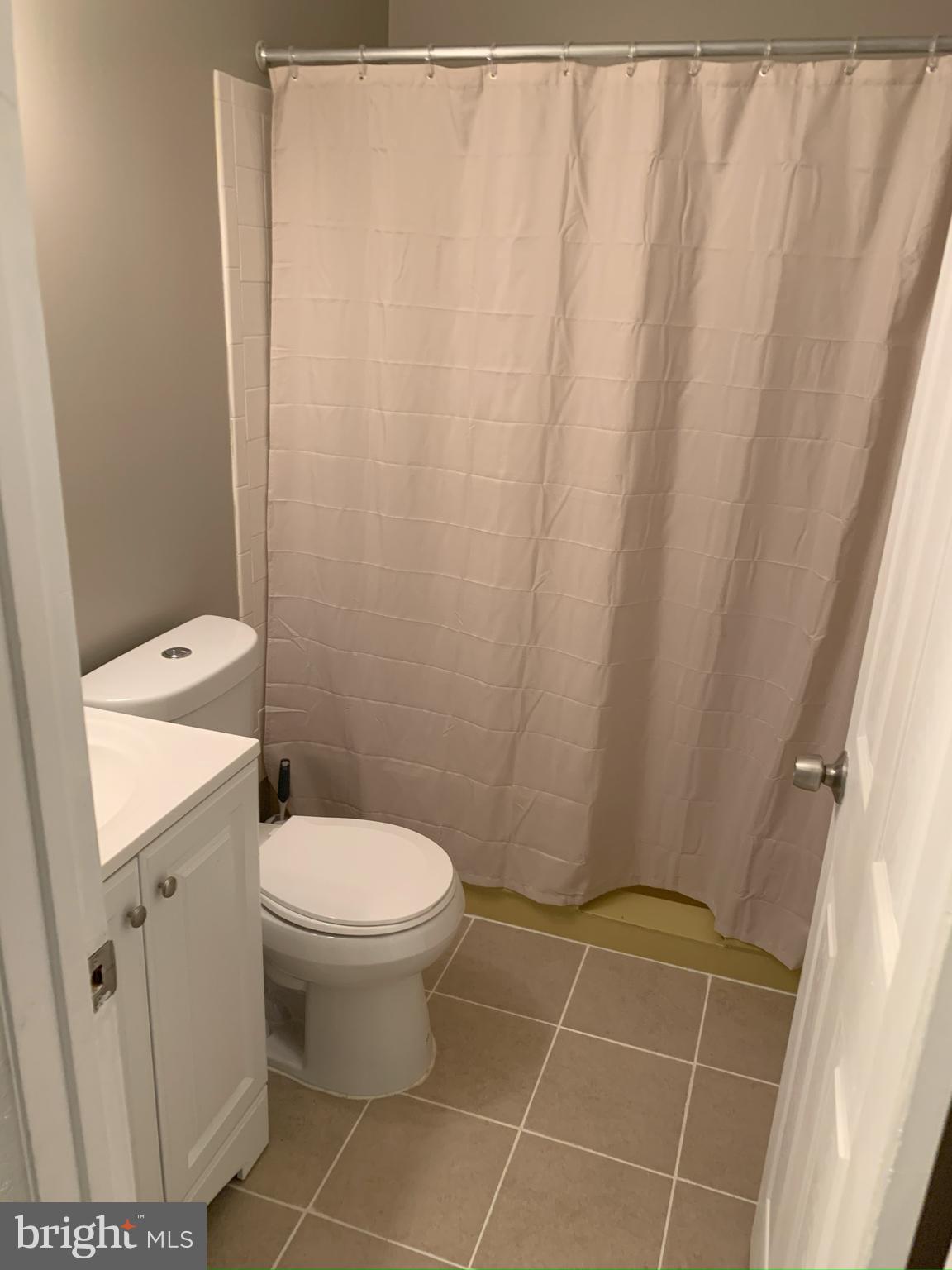 50 Georgetown Road Lindenwold, NJ 08021 - Photo 12 of 17 a bathroom with a toilet and a shower curtain