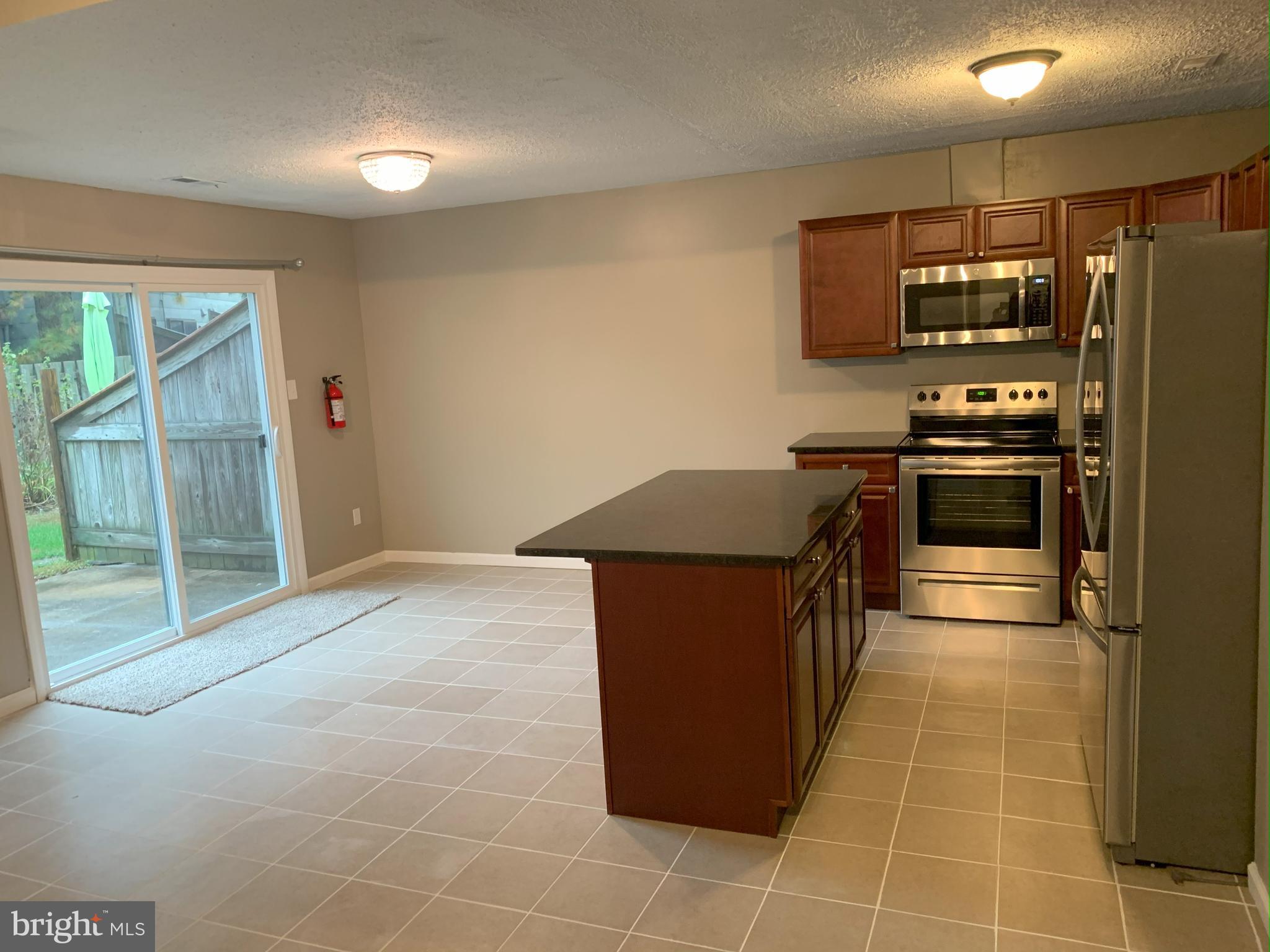 50 Georgetown Road Lindenwold, NJ 08021 - Photo 5 of 17 a kitchen with stainless steel appliances granite countertop a stove a sink and a refrigerator