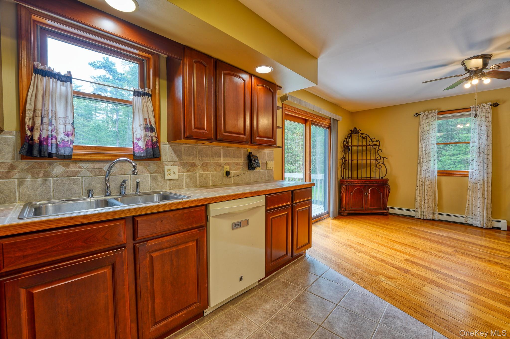 160 Barryville - Yulan Road Barryville, NY 12719 - Photo 5 of 38 Kitchen with decorative backsplash, light tile patterned floors, white dishwasher, a ceiling fan, and recessed lighting