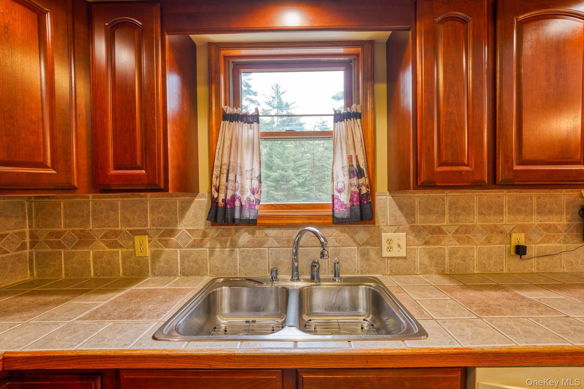 160 Barryville - Yulan Road Barryville, NY 12719 - Photo 6 of 38 Kitchen with decorative backsplash, tile counters, and reddish brown cabinets