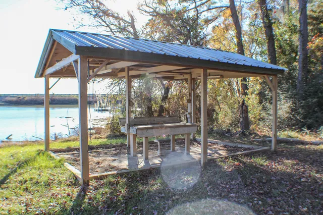 a view of a wooden deck with a backyard