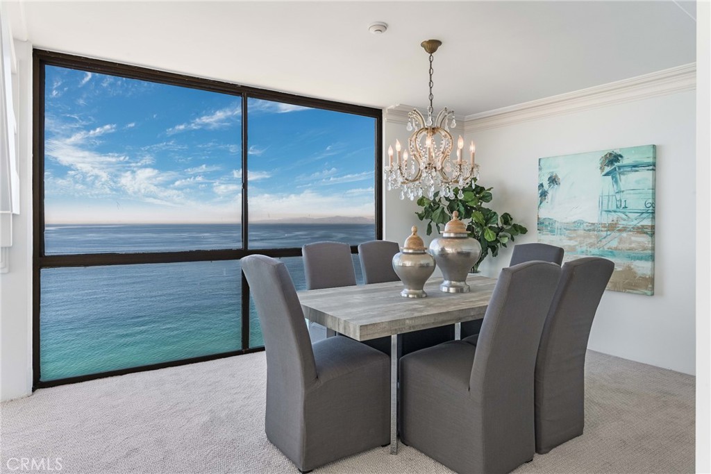 531 Esplanade, Unit 916 Redondo Beach, CA 90277 - Photo 14 of 41 a dining room with furniture potted plants and wooden floor
