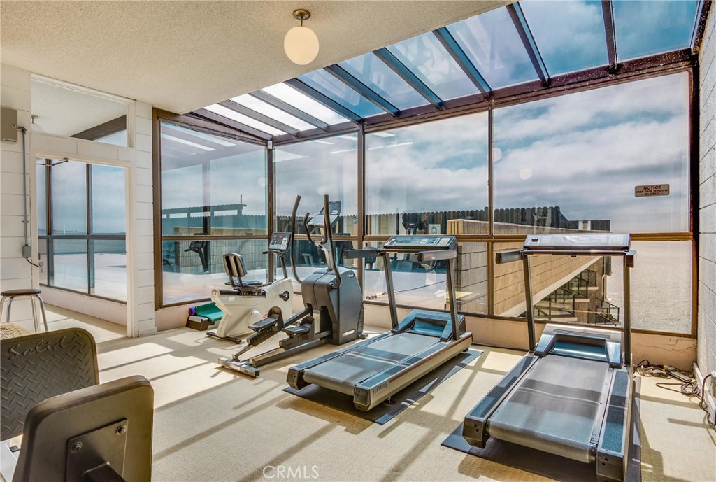 531 Esplanade, Unit 916 Redondo Beach, CA 90277 - Photo 35 of 41 a living room with furniture and floor to ceiling windows