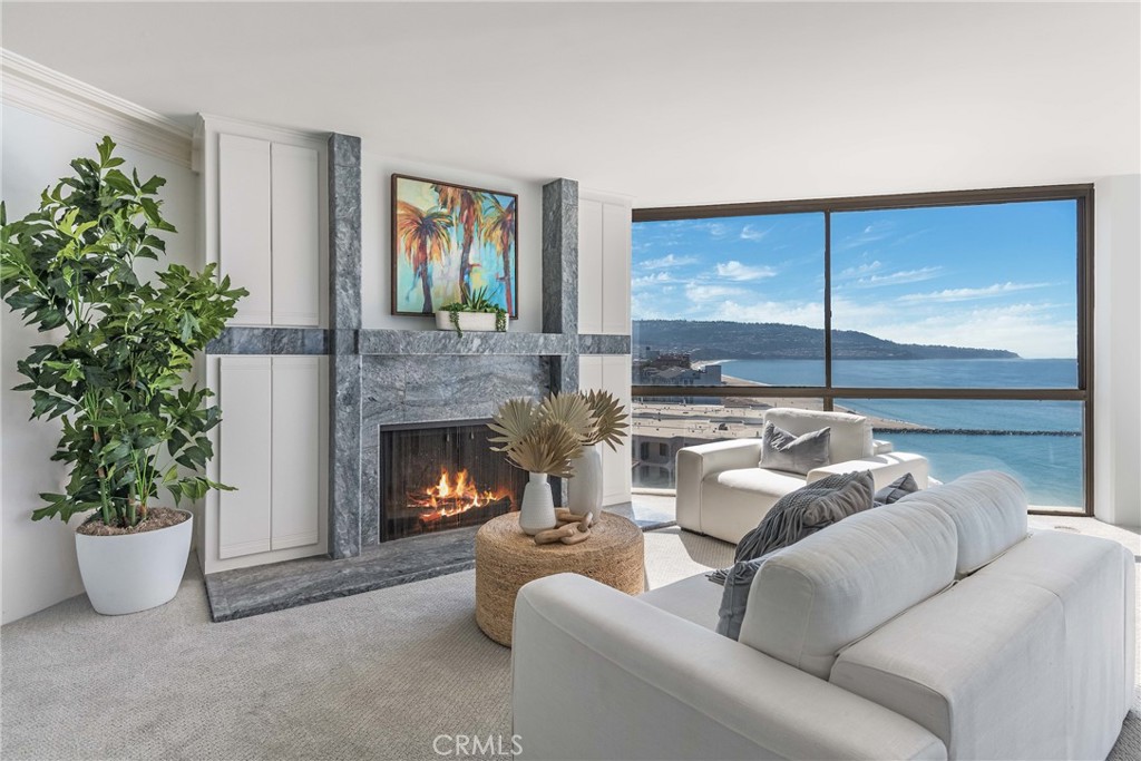 531 Esplanade, Unit 916 Redondo Beach, CA 90277 - Photo 4 of 41 a living room with furniture and a potted plant