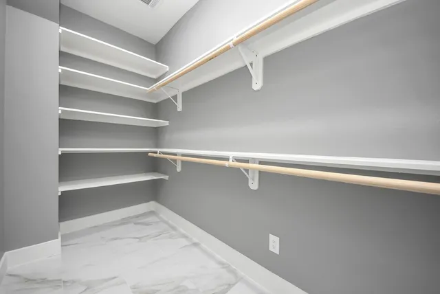 a view of an empty walk in closet