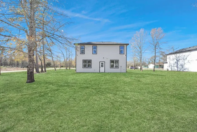 a view of a house with a big yard