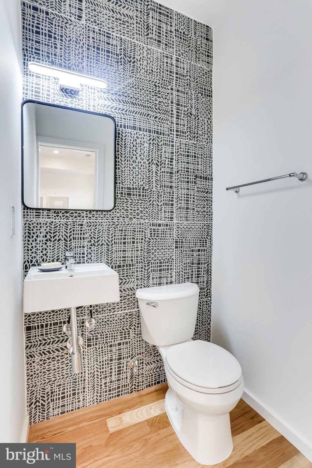 53 R Street Northeast, Unit 2 Washington, DC 20002 - Photo 13 of 25 a bathroom with a toilet and a sink