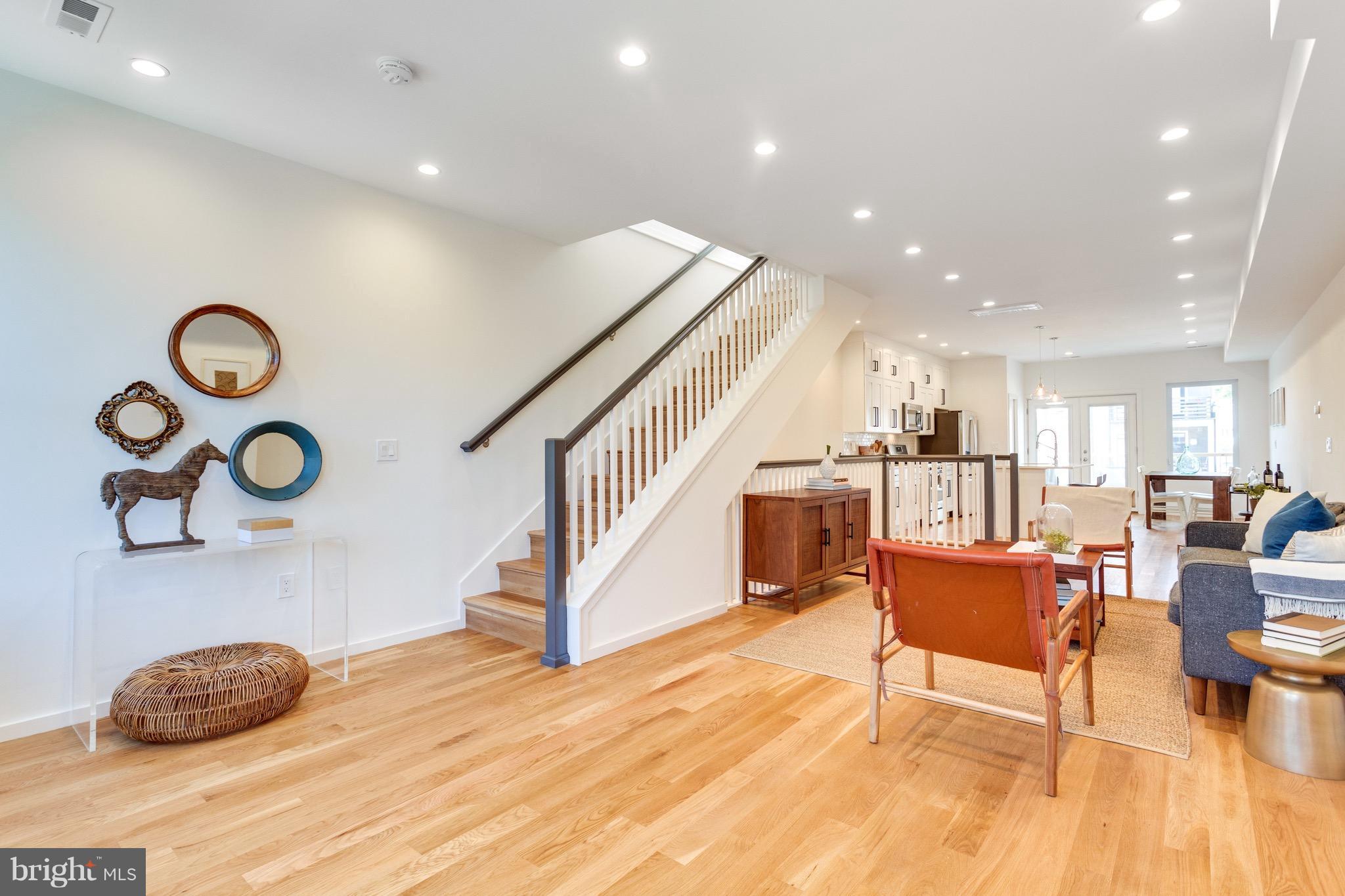 53 R Street Northeast, Unit 2 Washington, DC 20002 - Photo 9 of 25 a living room with furniture and wooden floor