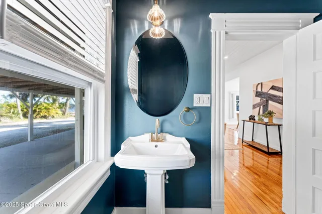 a bedroom with furniture and wooden floor